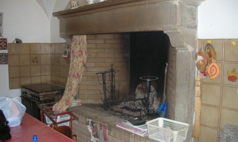 large fireplace in the kitchen on the first floor